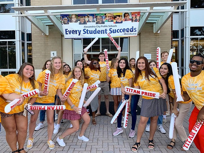 Members of the T.C. Williams High School leadership Team are all smiles as they greet arriving students for the first day of school Sept. 3.