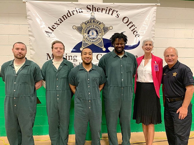 Sheriff Dana Lawhorne, right, with the winners of the HEARD Creative Writing Contest Aug. 22 at the William G. Truesdale Detention Center. From left: Joshua Mann, second place non-fiction; Nicholas DeLuca, first place fiction; Michael Pixley, first place non-fiction; Hashim Barner, first place poetry; and HEARD founder Jane Hess Collins.