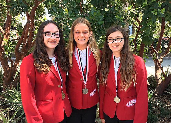 From left are STAR award winners Emily Sarber, Fairfax High sophomore; and Lanier Middle School eighth-graders Caitlyn Clark and Sierra Warden.