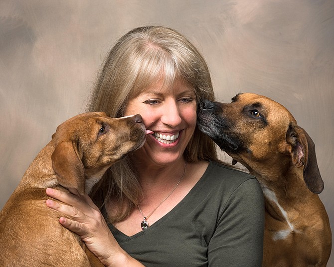 Annie Ballantine, with her two dogs Cassie and Bogey.