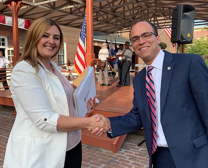 Malsha Arzana of Kosovo is congratulated by Mayor Justin Wilson after becoming a U.S. citizen Sept. 10 in Market Square.