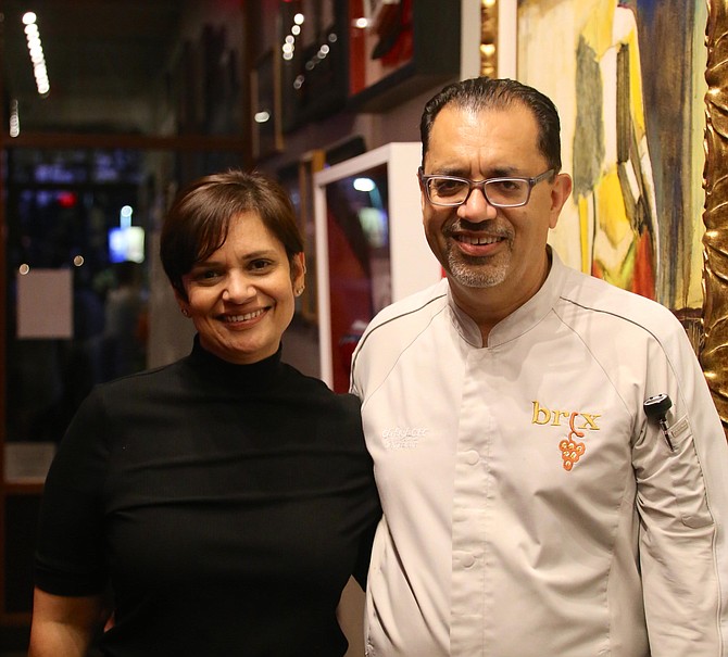 Ashwani Ahluwalia, the owner of BRX American Bistro in Great Falls, with his sister and part owner Dimple, at the restaurant art gallery.