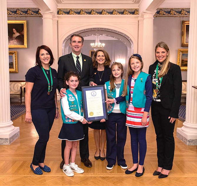 From left: Lisa Assaly (troop leader), Governor Ralph Northam, First Lady Pam Northam, Siena Assaly, Maria Borst, Peggy Borst (troop leader).  Front, Victoria Delacourt.