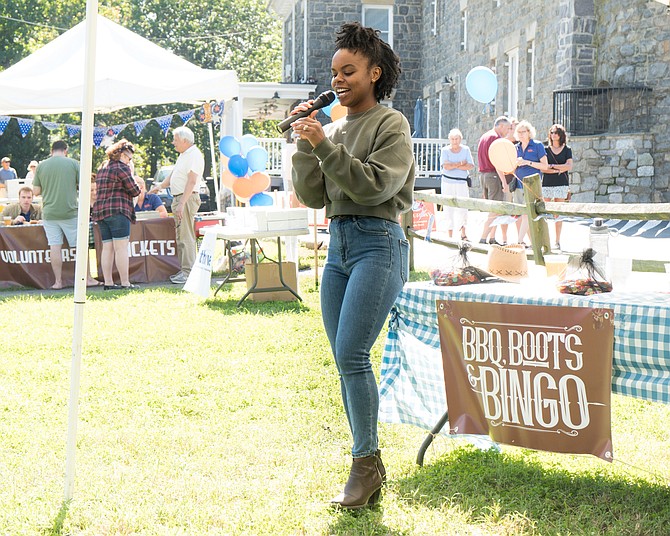 Thrive board member Jasmine Rogers calls bingo at the Thrive barbecue last year.