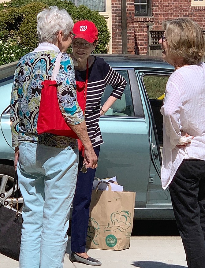 During Breast Cancer Awareness Month, survivors like Florence Murrian and mental health professionals share insight on offering support. Here, Murrian and friends volunteer for a supplies drive.