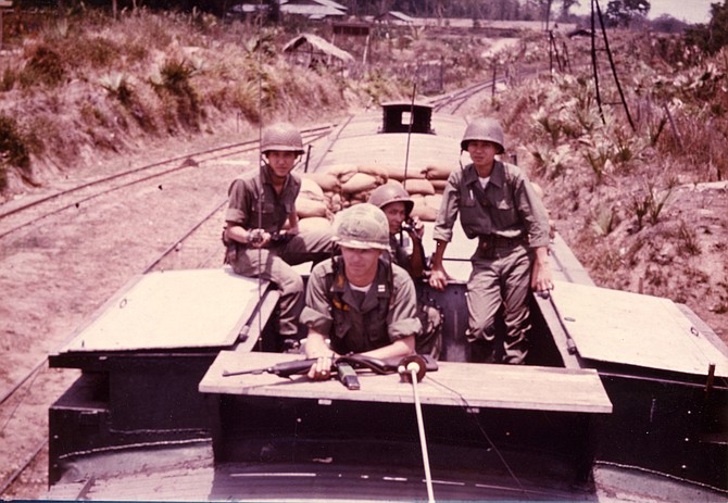 John Mason, author and presenter at 2019 Fall for the Book (center at front) riding the rails on duty in Vietnam, 1965.