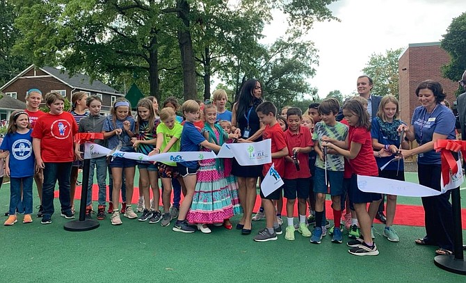 Mount Vernon Community School students, PTA members and ACPS officials celebrated the opening of the Mount Vernon Play Garden with a ribbon cutting ceremony Sept. 6.