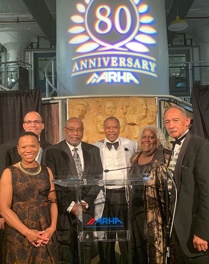 Erika Miller, Mayor Justin Wilson, Bill Euille, ARHA CEO Keith Pettigrew, Michelle Chapman and Roy Priest pose for a photo after each offered remarks in celebration of the 80th anniversary of ARHA Sept. 28 at the Torpedo Factory Arts Center.