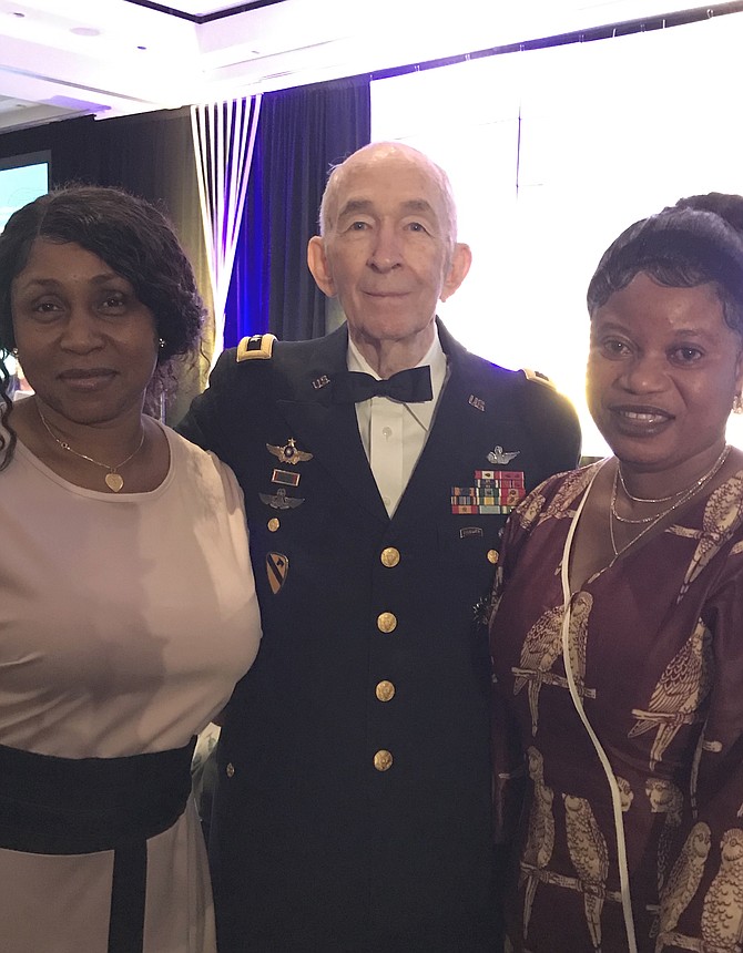 Major General Carl H. McNair Jr. (RET) joins his tablemates, Saffiatu Janneh and Kadiatu Kamara, before the start of 2019 Raise the Region Gala produced by The Community Foundation for Northern Virginia held at the Hilton McLean Tysons Corner on Friday evening, Oct. 4.