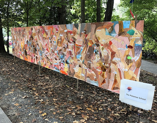 A mural painted by students at the Potomac School greets visitors along the main pathway.