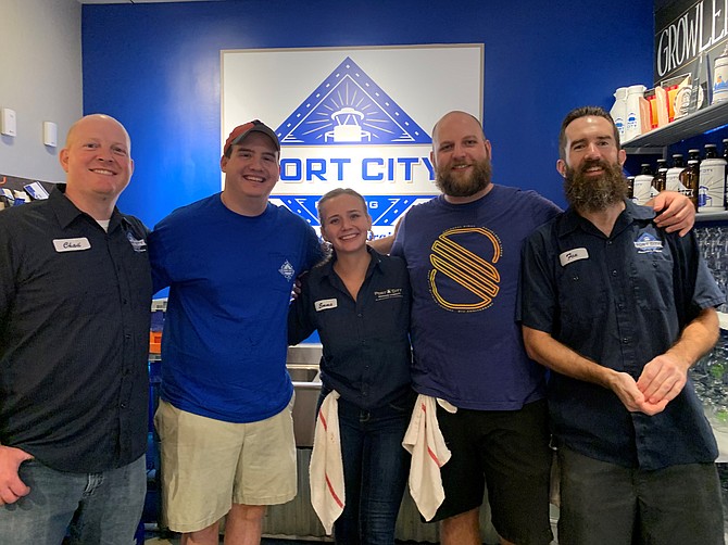 Port City Brewing Company bartenders Chad Droz, Emma Quinn, Tim Quintun and Justin Fox are ready to serve varieties of beer at the Sept. 26 Oktoberfest benefitting the Campagna Center.