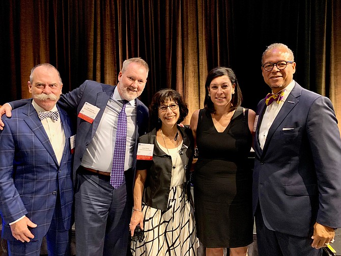 Business Leader of the Year Stephanie Landrum, second from right, with Burke and Herbert Bank representatives Hunt Burke, Joe Collum, Jane Petty and Walter Clarke at the Best in Business awards Oct. 2 at the Alexandria Westin Hotel.