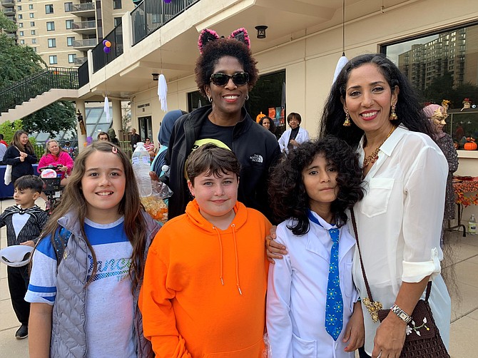 Spooky Mad Science Expo organizer Zohreh Khoshnamak, right, with Shadia Mohmmadi and brother Samyar, Nikpirouz Khoshnamak and Tara Jackson, in back, Oct. 5 at The Watergate at Landmark.