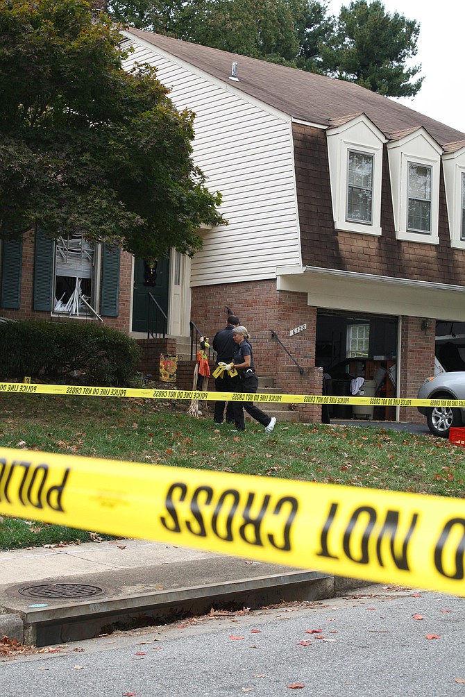 Crime scene tape and detectives in Burke.