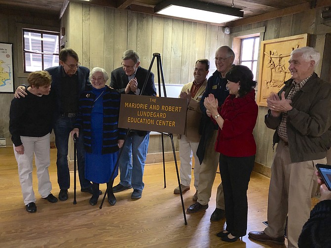Unveiling the new plaque for the Marjorie and Bob Lundegard Education Center, from left: Cindy Walsh, Paul Lundegard, Marjorie Lundegard, John Foust, Mike Henry, Tim Hackman, Barbara Favola, and Gene Bacher.