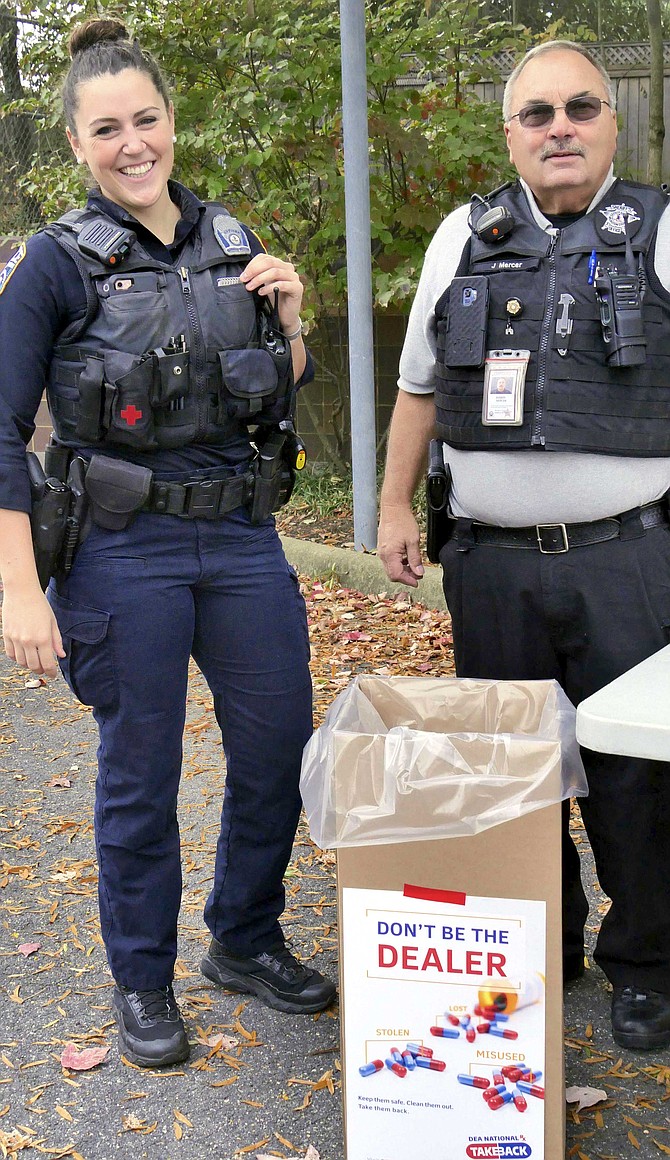 ACPD Community Outreach Officer Christin Oesterling and Sheriff's Department Reserve Deputy Officer Jeff Mercer.