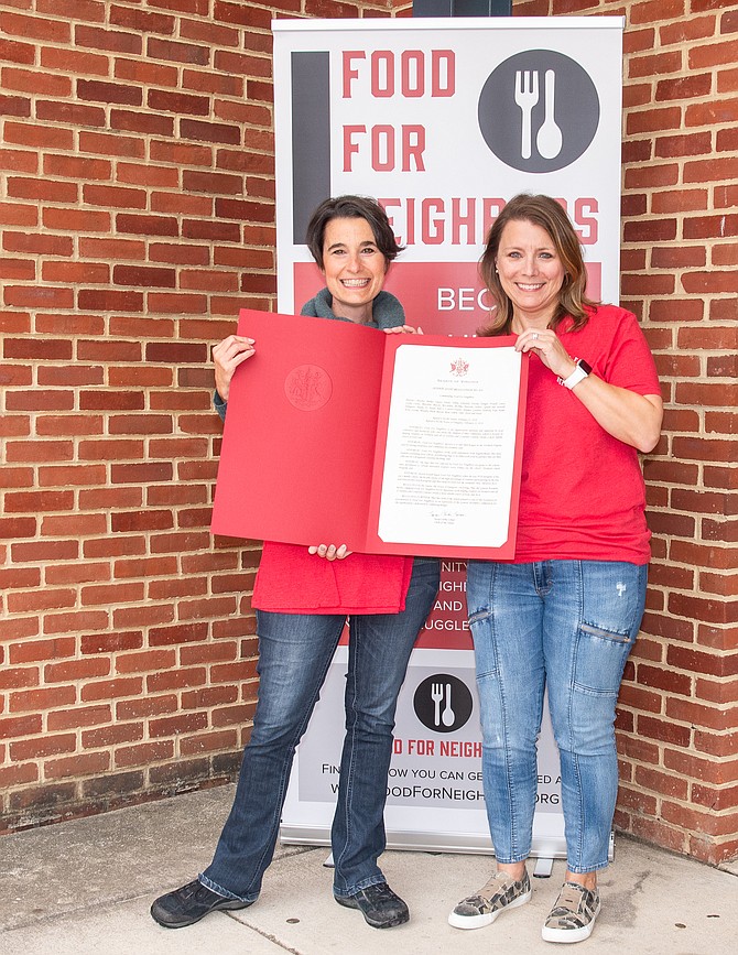 State Sen. Jennifer Boysko presents the Virginia General Assembly commendation to Food For Neighbors, represented by dedicated volunteer Christa Soltis.