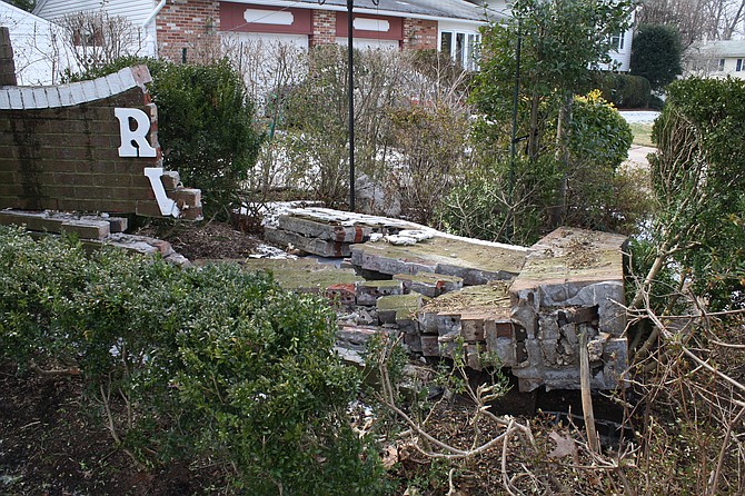 Last winter, someone ran into the community sign on Rolling Road.