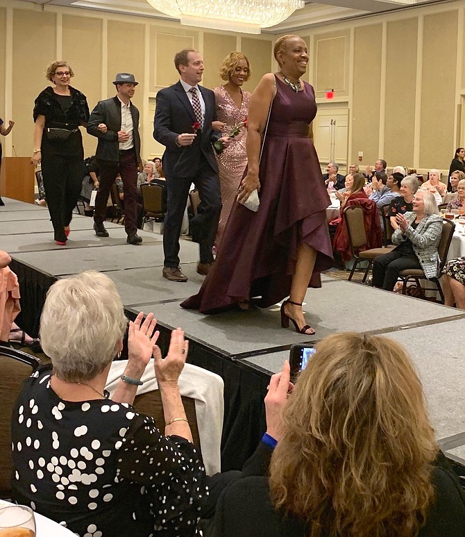 Wearing clothing provided by Lord & Taylor, models take to the runway at the annual Board of Lady Managers fashion show and luncheon Oct. 25 at the Mark Center Hilton. The organization raises funds to provide support to Inova Alexandria Hospital.