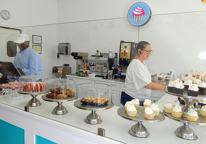 Vada Smith and Chrissy Fauls working behind the counter.