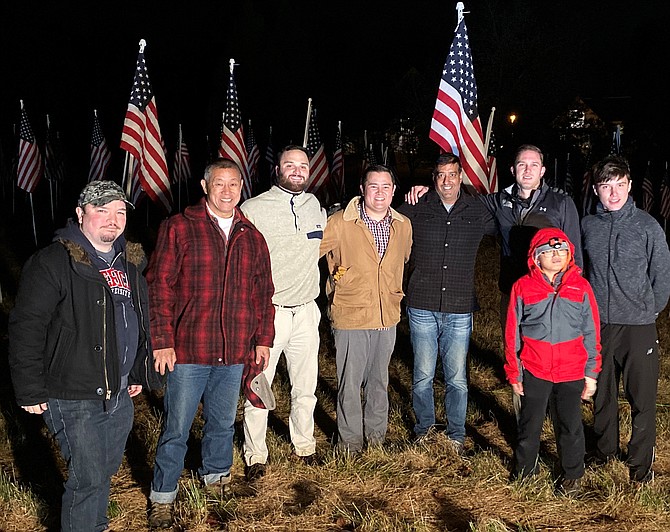 At dusk this past Friday, volunteers assembled in front of Saint Francis Church to construct the display which continued to stand through Veterans Day.