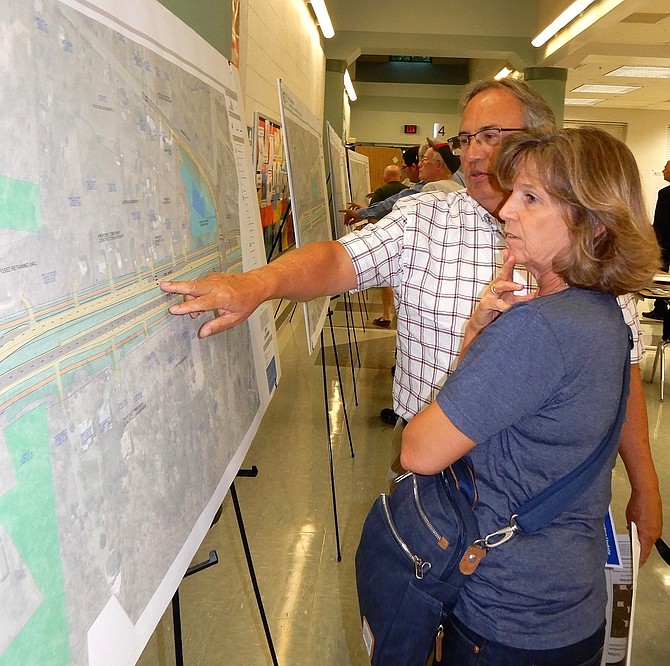 Centreville residents Teri and Marie Travi look at the project map, but worry that Route 28 will still be a bottleneck in Prince William County.