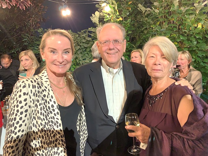 Brooke Sydnor Curran, left, with Lonnie Rich and Ginny Hines, celebrates at the Mile Marker 10 celebration of the RunningBrooke nonprofit’s 10th anniversary Oct. 19 at the home of Chris and Brooke Curran.