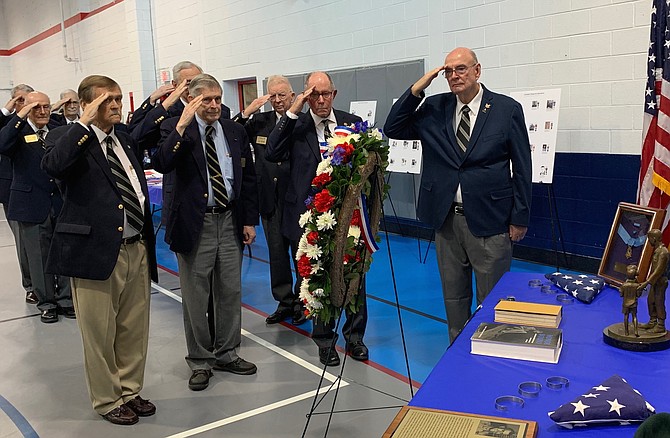 Members of the West Point Class of 1959 salute after presenting a wreath in memory of classmate and Medal of Honor recipient Rocky Versace at the Veterans Day Ceremony Nov. 11 at the Mount Vernon Recreation Center.