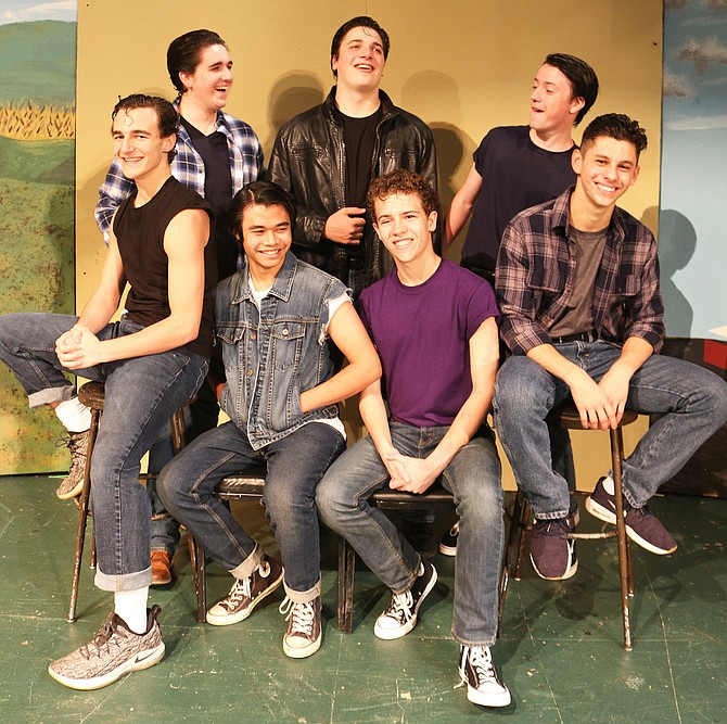 Recreating a poster from Francis Ford Coppola’s 1983 movie of “The Outsiders” are (front row, from left) Adam Hill (Two Bit), Martin Umali (Johnny Cade), Jak Ketron (Ponyboy Curtis) and Nick Burgos (Steve Randle); and (back row, from left) Ryan Jahn (Darry Curtis) Davis Trax (Dallas Winston) and Rixon Webb (Sodapop Curtis).