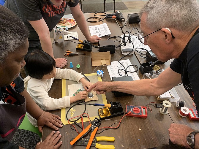 Chantilly’s Nick Carter demonstrates how to solder electric circuits.