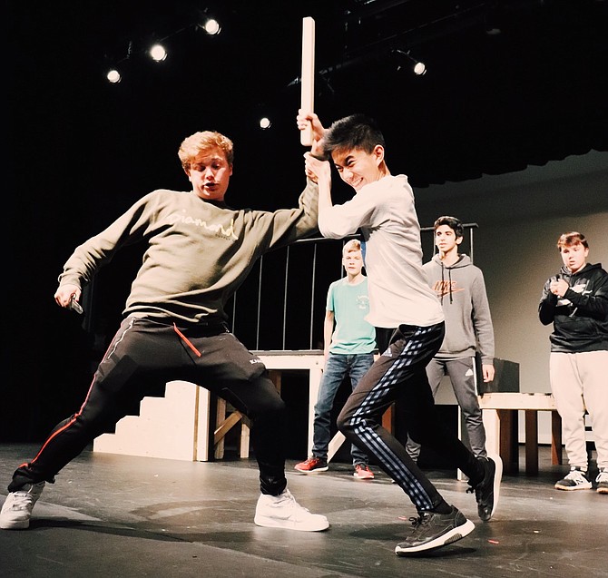 Chris Morgan (Tybalt) and Leland Hao (Benvolio). Standing behind are Nicolas Kristensen (Ensemble), Ethan Bhatia (Abraham), and Eli Roberts (Ensemble). Here Tybalt starts a brawl after Benvolio was only trying to keep the peace at the start of the show.