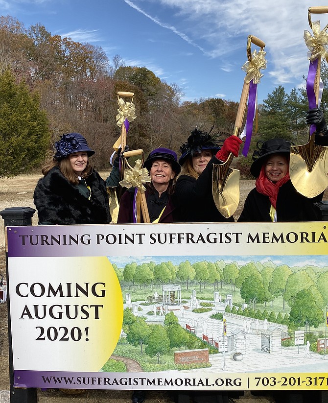 Dressed as American suffragists Alice Paul, Rose Winslow, Lucy Burns and Elizabeth Cady Stanton respectively, from left: Debbie Glaser of Woodbridge, Julianna Smith of  Woodbridge, Michelle McCall of Herndon and Quinn Jones of Arlington hold up shovels used at the Turning Point Suffragist Memorial Groundbreaking at Occoquan Regional Park, Lorton, Nov. 14, 2019.