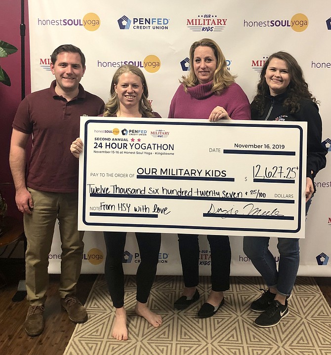 In between the downward dogs and warrior II poses, it’s Spencer Kenyon, Corporate Communications Manager, PenFed Credit Union; Suzie Mills,CEO, Honest Soul Yoga; Michelle L. Nelson, Family Programs Director, Our Military Kids; and Michelle Criqui - Social Media & Web Manager, Our Military Kids.