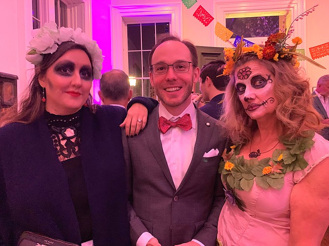 Brian Kelley, center, with Allison Nance and Lisa Schmaier celebrate at the Athenaeum’s Day of the Dead Membership Appreciation Night Nov. 2 at the Athenaeum.