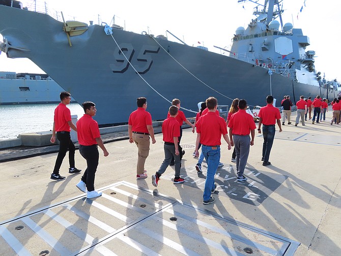 Cadets march down the pier at Norfolk Naval Base.