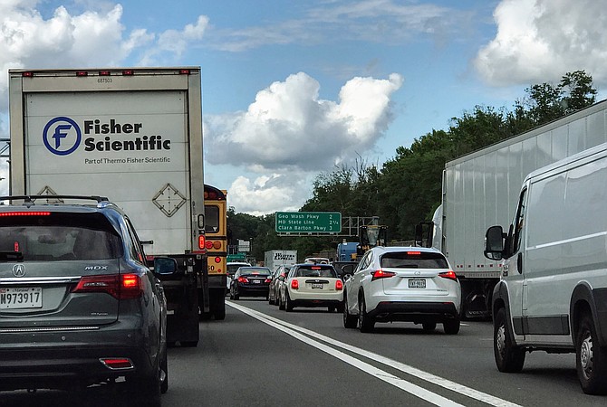 The Beltway in Virginia, where the Express Toll lanes end and merge into the regular lanes in McLean approaching the American Legion Bridge. Long backups have developed on the Beltway and down the George Washington Parkway here.