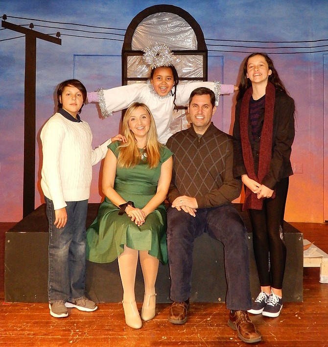 Cast members of City of Fairfax Theatre Co.’s upcoming play include Lilith Nees (the angel) and (front row, from left) Thomas Kennedy, Mindy Thomas, Gregory Kennedy and Mary Kennedy.