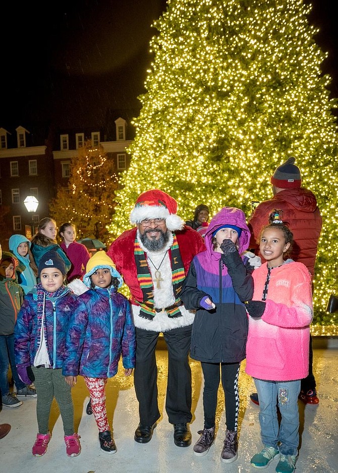 Children gather for a photo with Santa following the annual lighting of the Market Square tree Nov. 23 at City Hall.