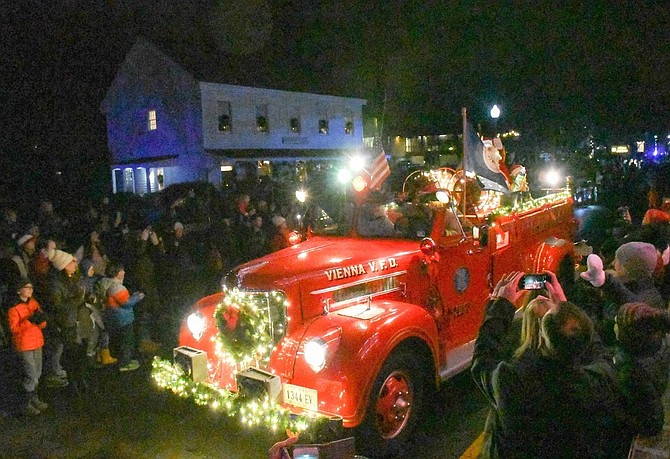 Santa waved to the crowd as he rode in on a 1940s VVFD firetruck.