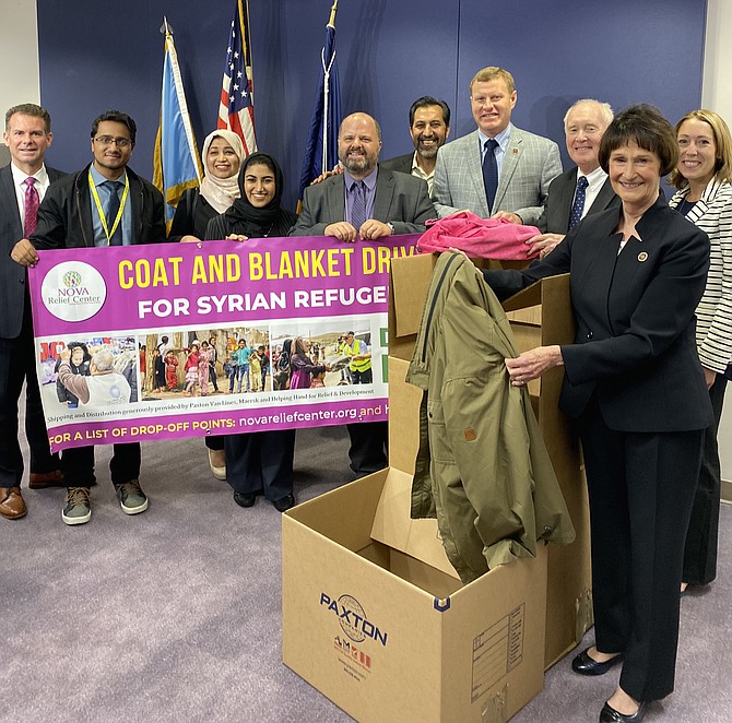 Kicking off the Blanket & Coat Drive: Brody Buhler, Church of Jesus Christ of Latter-day Saints; Abdun Nafey Matin, Assistant Helping Hand for Relief and Development; Nausheen Baig and Rabia Baig, All Dulles Area Muslim Society; Martin Nohe, Prince William Board of Supervisors; Asif Khan, Helping Hand for Relief; Jeff McKay; Mark Gibb, Northern Virginia Relief Center; Sharon Bulova; and Mary Kathleen Paxton.