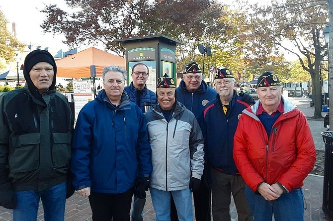 Members of American Legion Post 24 kick off the 2019 Salvation Army Bell Ringing season Nov. 16 at Market Square in Alexandria. Braving the blustery morning are (l-r); Sandy Sanor, Ozzie Abijaoude, Norman Sleeper, Al Soto, Joe Zelinka, Jim Glassman and Post 24 Commander Henry Dorton.