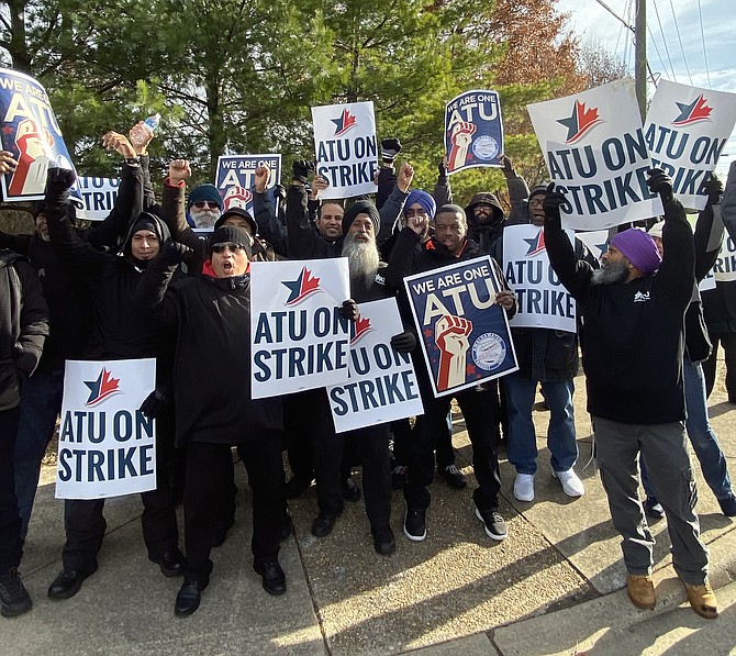 Amalgamated Transit Union Local 1764 Transdev workers picket in Herndon Friday morning, Dec. 6.