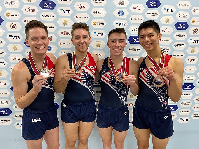 Brandon Krzynefski, 2nd from left, with the power tumbling team.