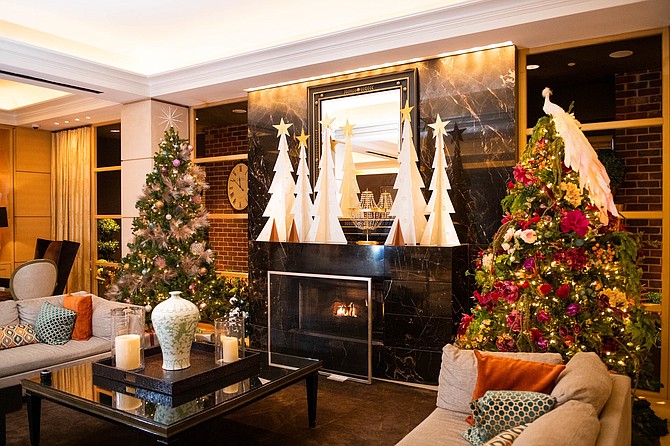 Erica Burns of Erica Burns Interiors designed a holiday tree that features bright colors, sparkling materials, and soft and textured finishes to engage the senses.