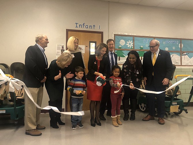 First Lady of Virginia Pamela Northam helps cut the ribbon at Mount Vernon childcare center.