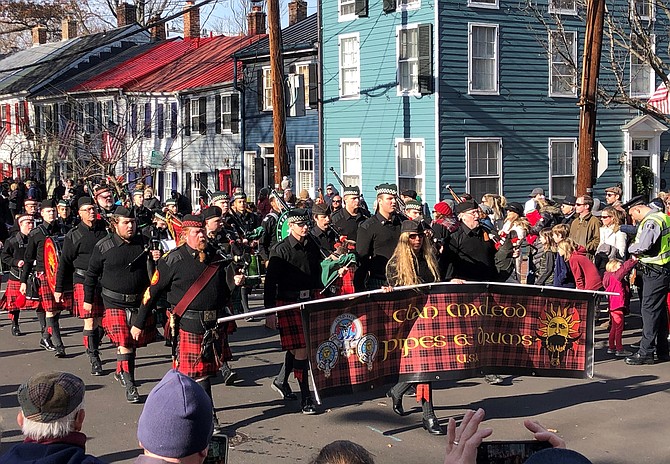 Clan MacLeod Pipes and Drums walks through the streets of Old Town during the Campagna Center’s 49th annual Scottish Walk Parade Dec. 7.