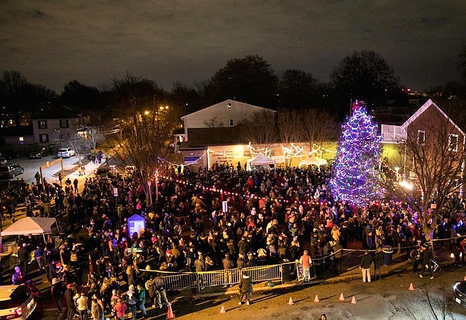 Hundreds gather for the lighting of a community Christmas tree and Menorah Dec. 8 at the Pat Miller Neighborhood Square in Del Ray.