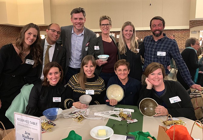 Mayor Justin Wilson, second from left in back, joins the Community Champion Sponsor Jen Walker Team for a photo at the 5th annual ALIVE! Empty Bowls Alexandria fundraiser Nov. 16 at the Durant Arts Center. The event raised $75,000 for the nonprofit organization’s programs.