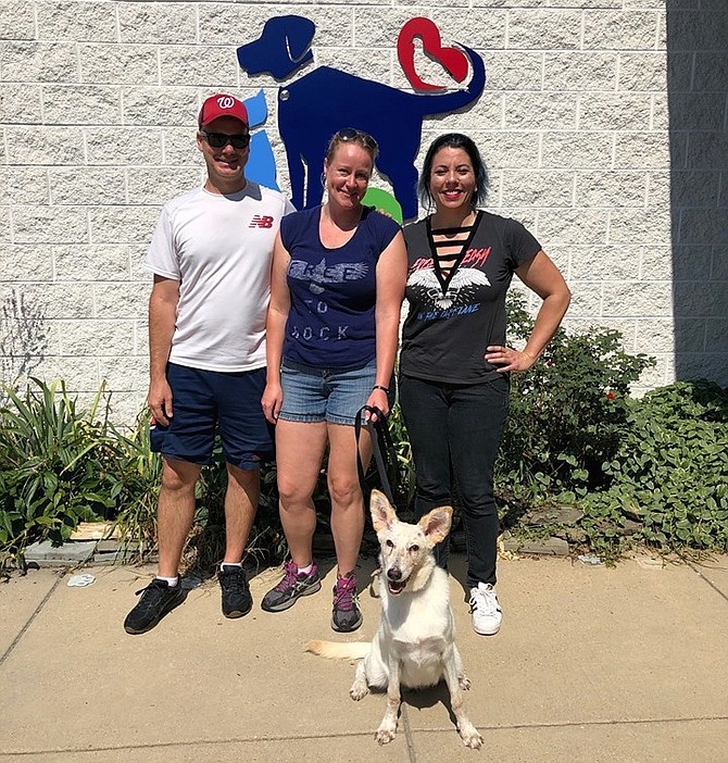 Vixen on adoption day — with foster caregivers Lloyd and Jackie Graybill and adopter Amanda Paz.