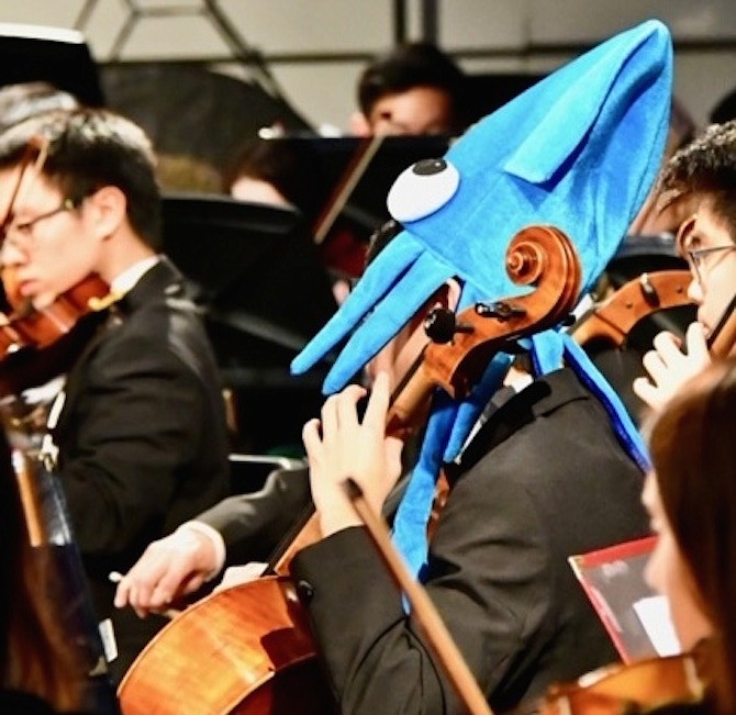 A Langley Orchestra student dressed as a sea creature in honor of their H2O performance.